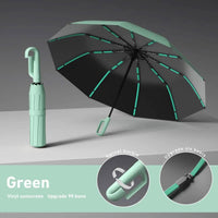 Automatic Folding Umbrella in black and green with a vinyl sunscreen canopy, swivel buckle, and six reinforced ribs for wind resistance