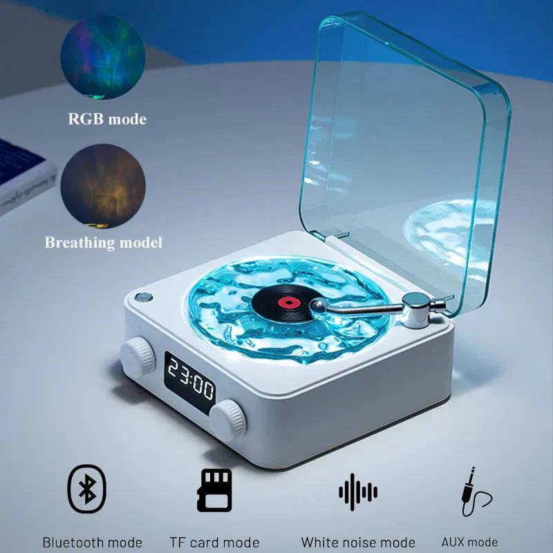 Mini Retro White Noise Bluetooth Speaker in white with a transparent lid, blue water ripple design, LCD display, and control knobs