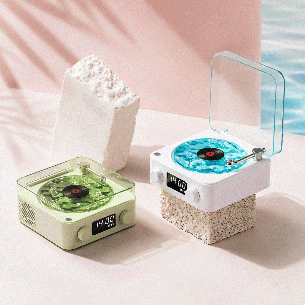 Mini Retro White Noise Bluetooth Speaker set in white and light green with translucent lids and vintage record player design, digital display and control knobs